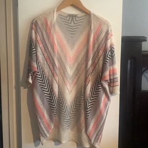 Fun cardigan/ no size on tag but fits size Medium